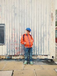 Boy standing with umbrella