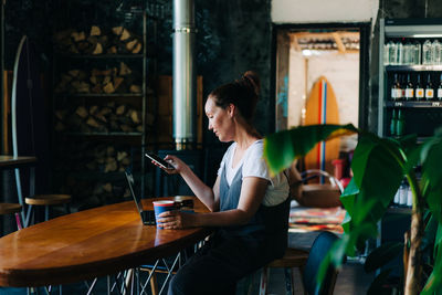 Woman sitting in restaurant