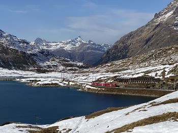 Scenic view of snowcapped mountains against sky during winter