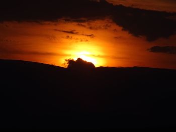 Silhouette of mountain against sky during sunset