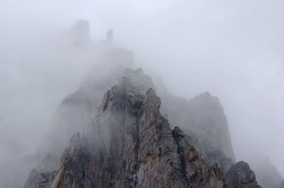 Panoramic view of mountains in foggy weather