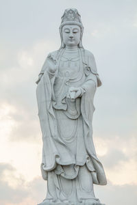 Low angle view of statue against sky