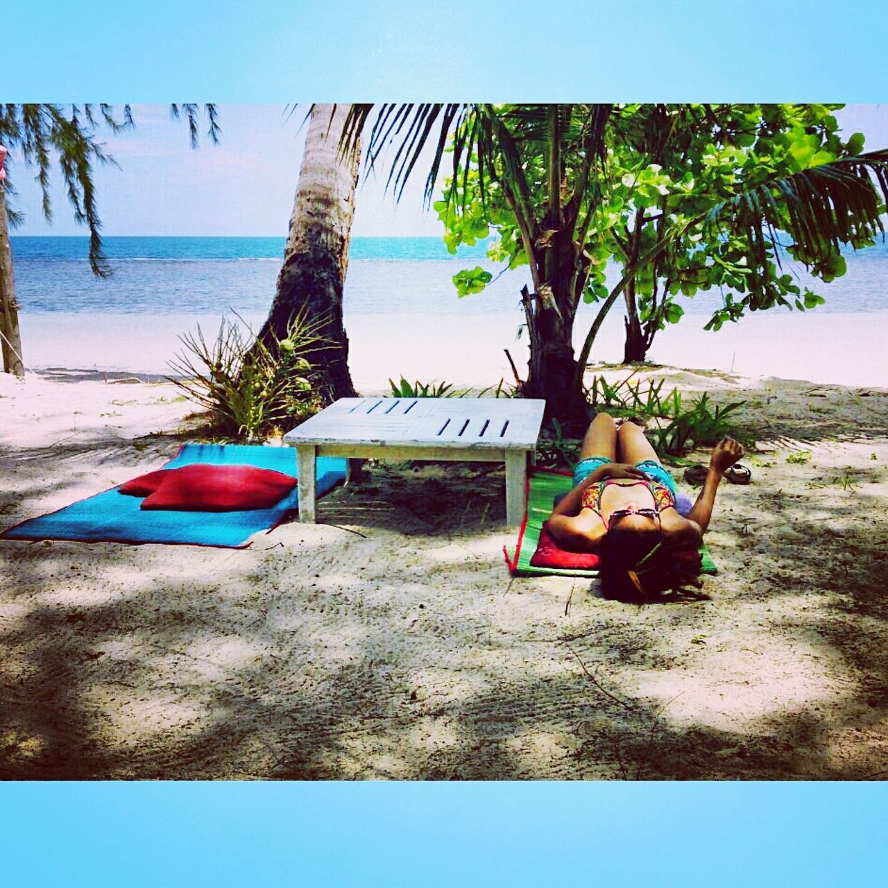 beach, tree, day, hammock, sand, sea, leisure activity, full length, outdoors, real people, nature, palm tree, one person, water, sky, lying down, vacations, beauty in nature, lifestyles, horizon over water, nautical vessel, people