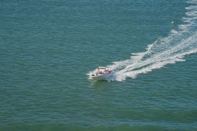 Aerial view of speedboat in sea