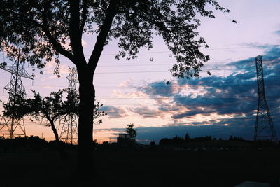 Silhouette of trees against sky at sunset