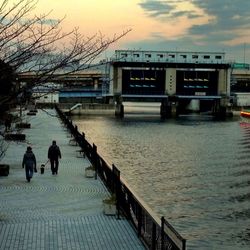 People in water at sunset