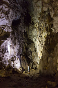 Man walking in cave