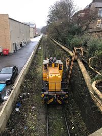 High angle view of railroad tracks by street