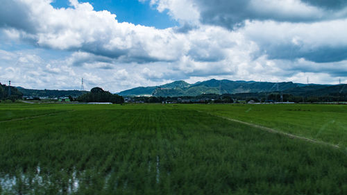Scenic view of landscape against cloudy sky