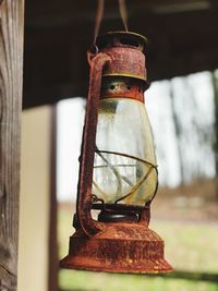 Close-up of old lantern hanging on table