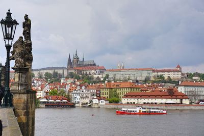 View of buildings against cloudy sky