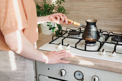 Midsection of man preparing food on table