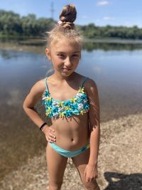 Full length of woman standing at beach