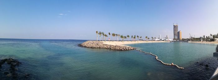 Scenic view of sea against blue sky