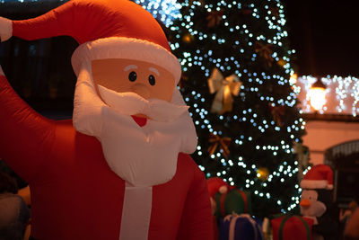 Close-up of illuminated christmas decorations at night
