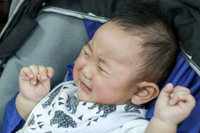 Close-up of baby boy sleeping in bus