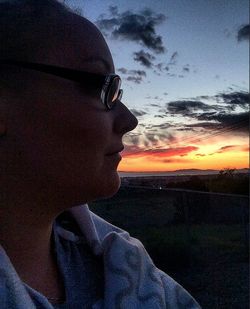 Woman looking at sunset