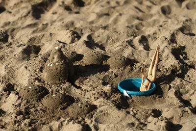 High angle view of toy on sand