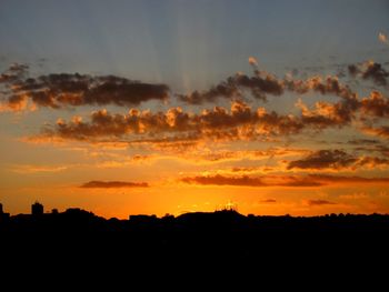 Scenic view of dramatic sky during sunset