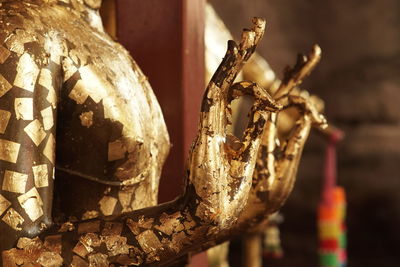 Buddha statue with gold leaf adornment at wat yai chai mongkhon temple, ancient city of ayudhaya,