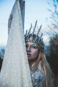 Portrait of young woman outdoors