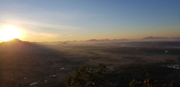 Scenic view of mountains against sky during sunset