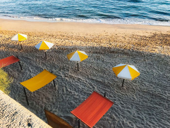 High angle view of yellow umbrella on beach
