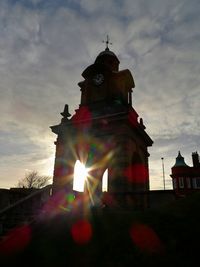 Low angle view of building against sky at sunset