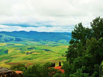 Scenic view of landscape against cloudy sky