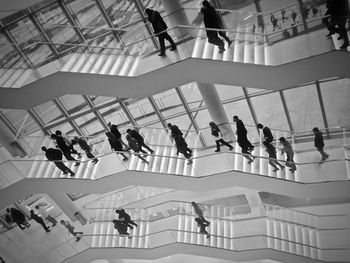 High angle view of people on staircase in building