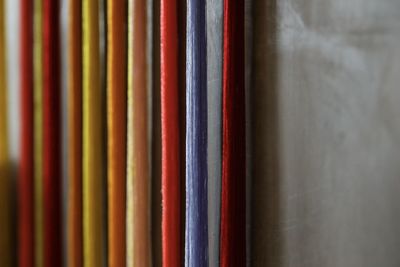 Close-up of multi colored books on shelf