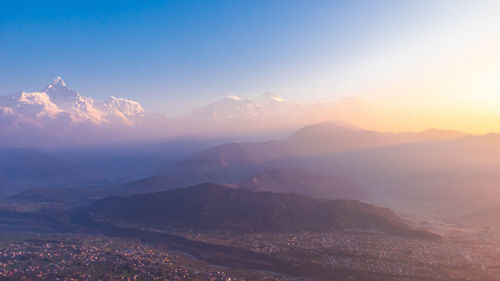 Scenic view of mountains against sky during sunset