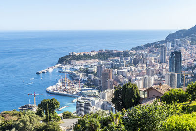 Aerial view of monaco with skyscrapers and blue sea