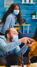 Family playing game at home during covid-19