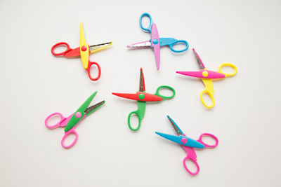 High angle view of colorful paper over white background