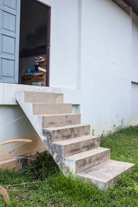 Man sitting on staircase of building