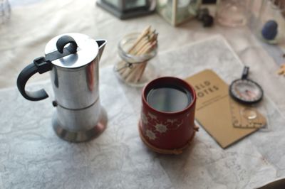 High angle view of coffee cups on table