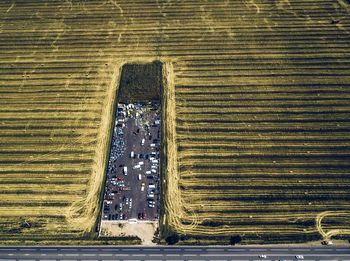 Aerial view of parking lot amidst farm