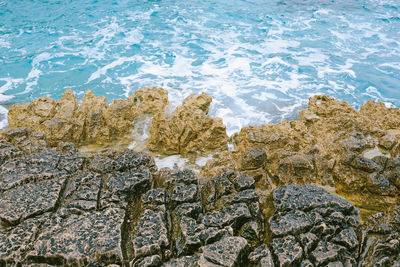 High angle view of rock formation on beach