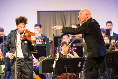 Men playing in music concert