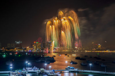 Fantastic and colorful fireworks display over the night sky of the city