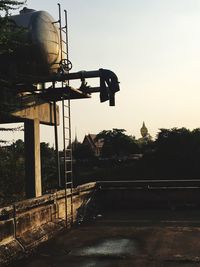 Silhouette bridge against sky during sunset