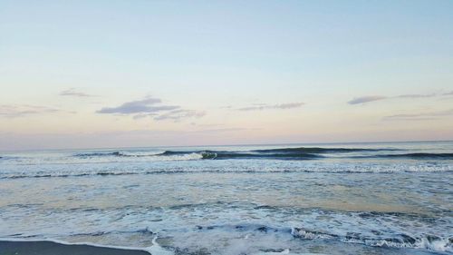 Scenic view of calm sea against sky