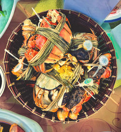 High angle view of fruits in basket on table