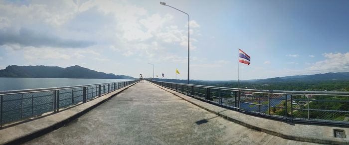 Scenic view of bridge over mountain against sky