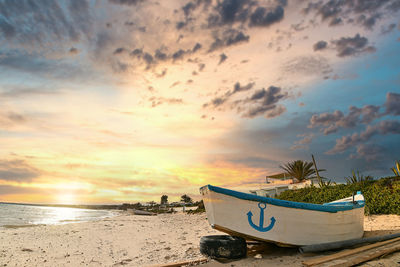 Scenic view of beach against sky during sunset