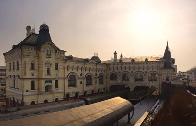 Buildings in city at sunset