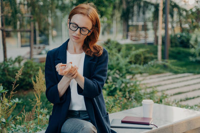 Young woman using mobile phone