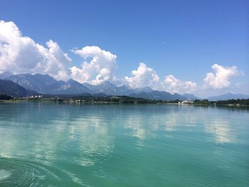 Scenic view of lake against cloudy sky