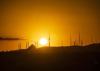 Sunrise and mosque and city silhouette in istanbul